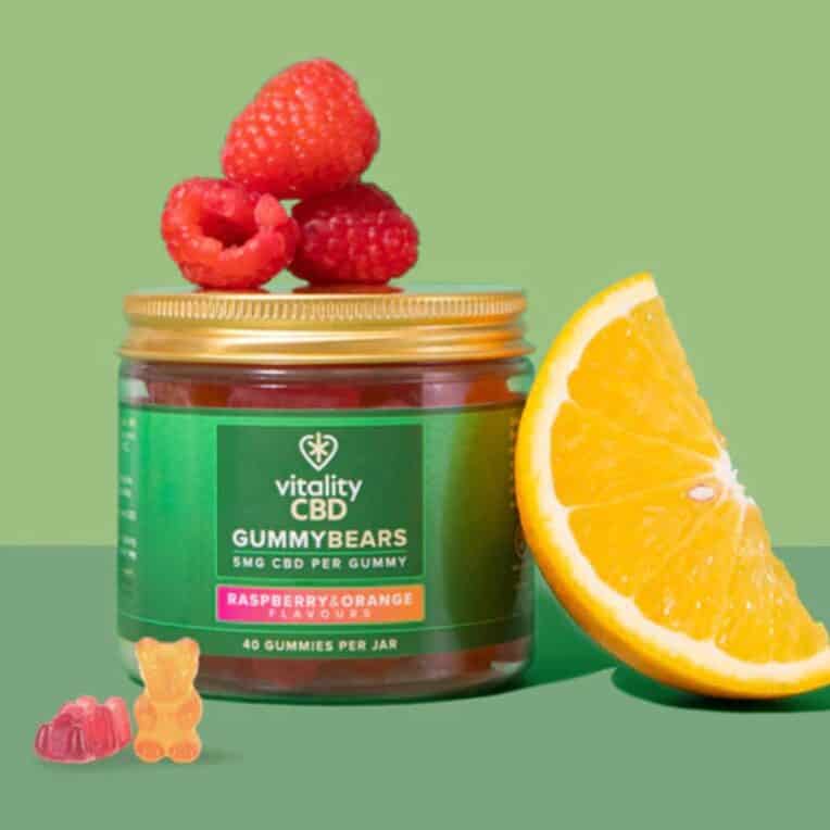 Vitality CBD Gummies orange raspberry green background