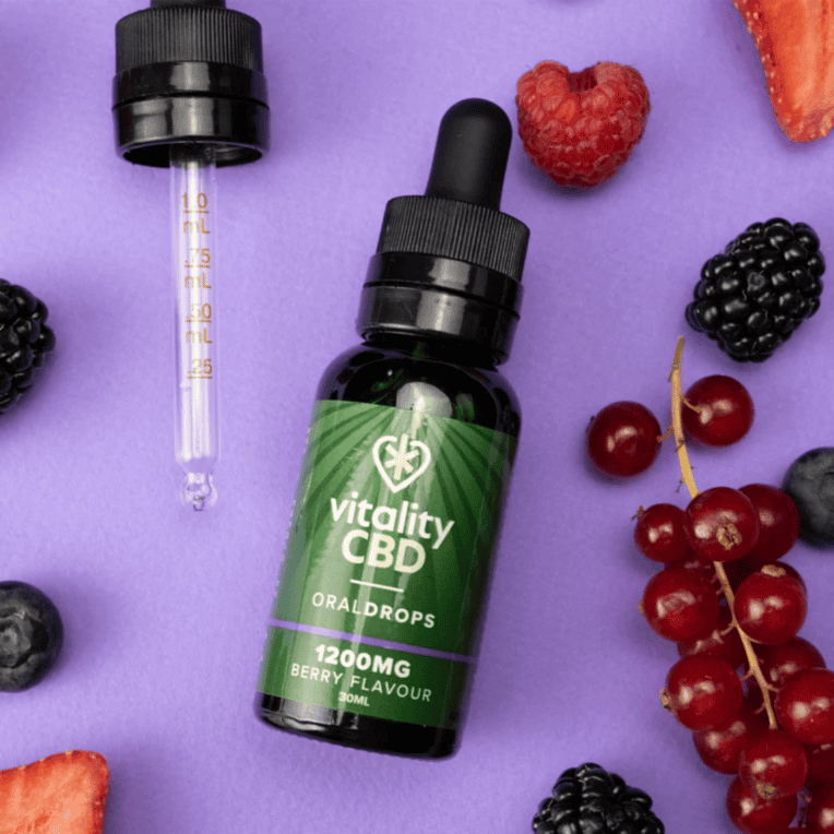Vitality CBD Oral Drops 1200mg berry fruit with pipette purple background