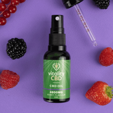 Vitality CBD Oral Drops Spray 4800mg berry fruit purple background