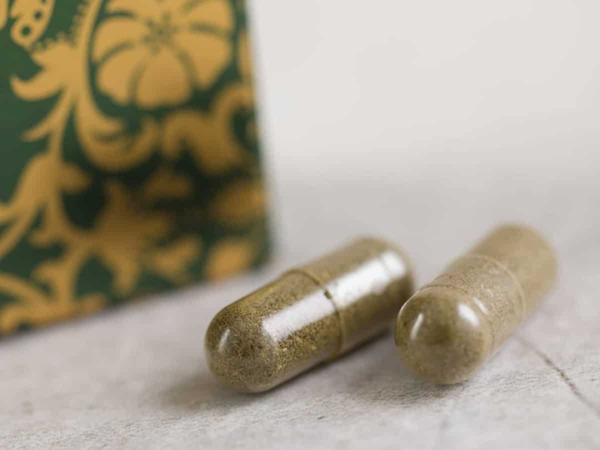 Hempura CBD Capsules close up on table with corner of box