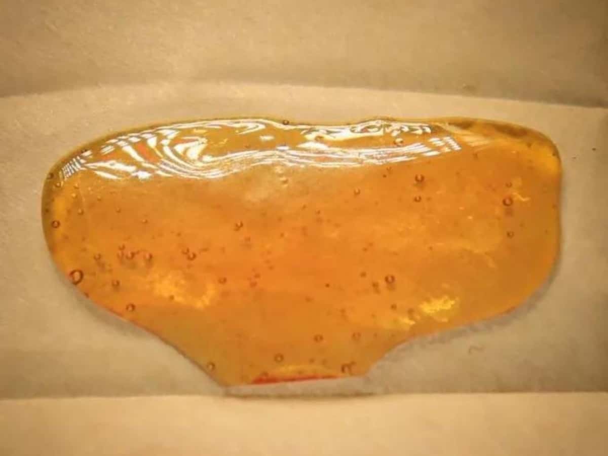 HighKind Pull n Snap CBD Shatter on brown parchment paper