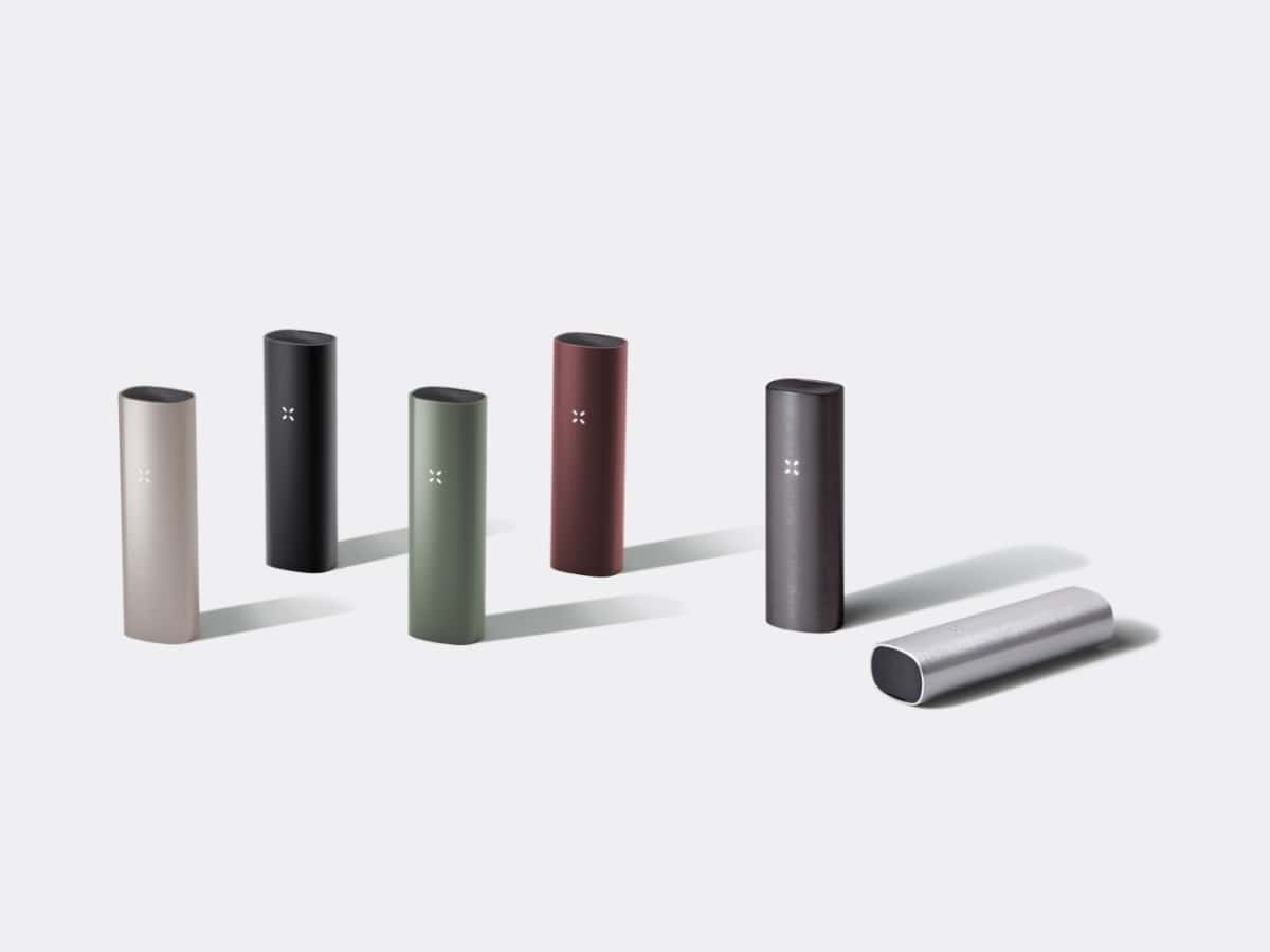 Different colours of PAX 3 vaporiser side by side staggered grey background