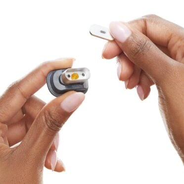 PAX Concentrate insert wiht wax in hands