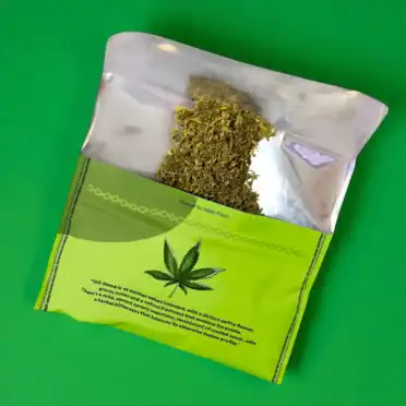 Professor Herb Hemp Smoking Blend 1400mg CBD - Classic Organic Open Spilled material green background