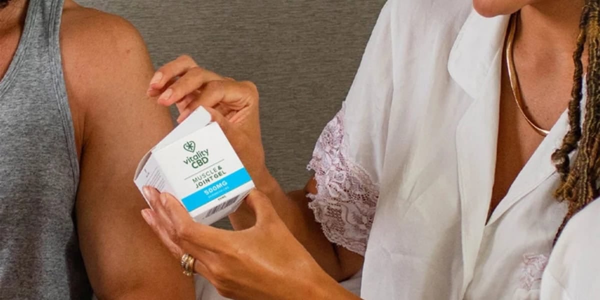 Woman and man using CBD muscle and joint gel by Vitality CBD