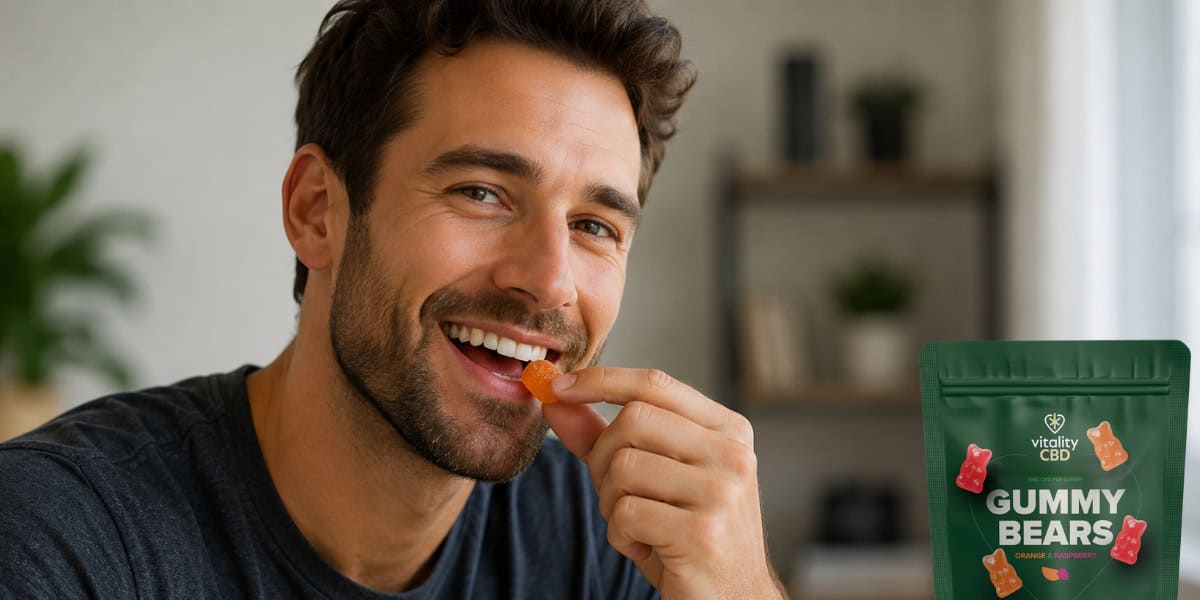 Man smiling eating a Vitality CBD gummy