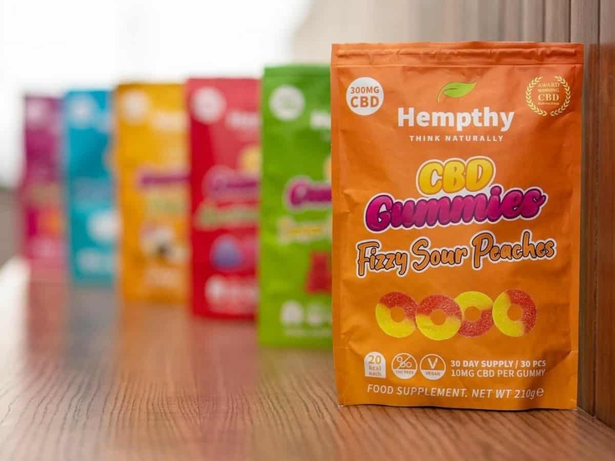 Hempthy CBD Gummies on table blurred background