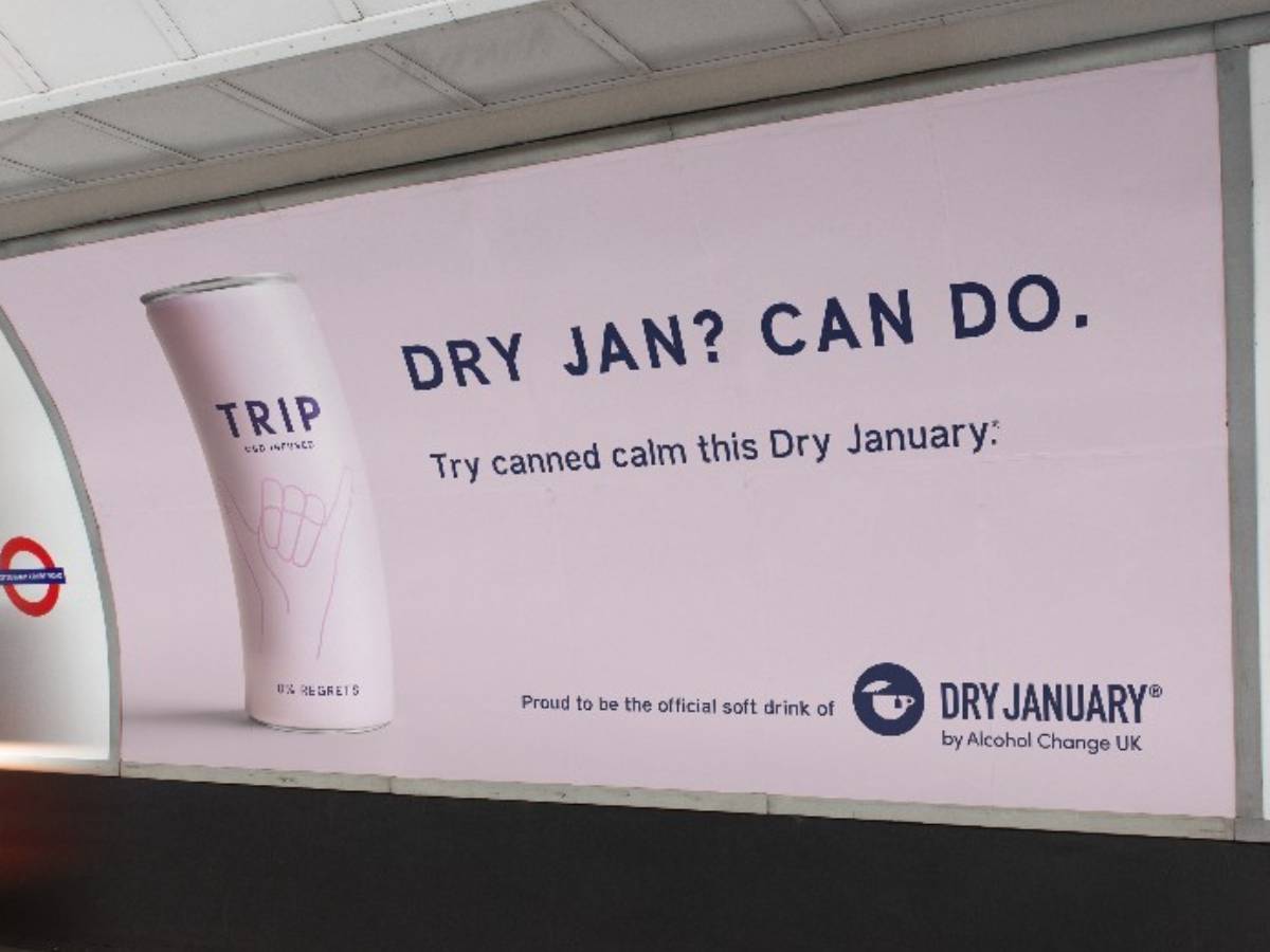 a london underground advert with a tin of trip cbd. the text says: dry jan? can do. Try canned calm this dry january.