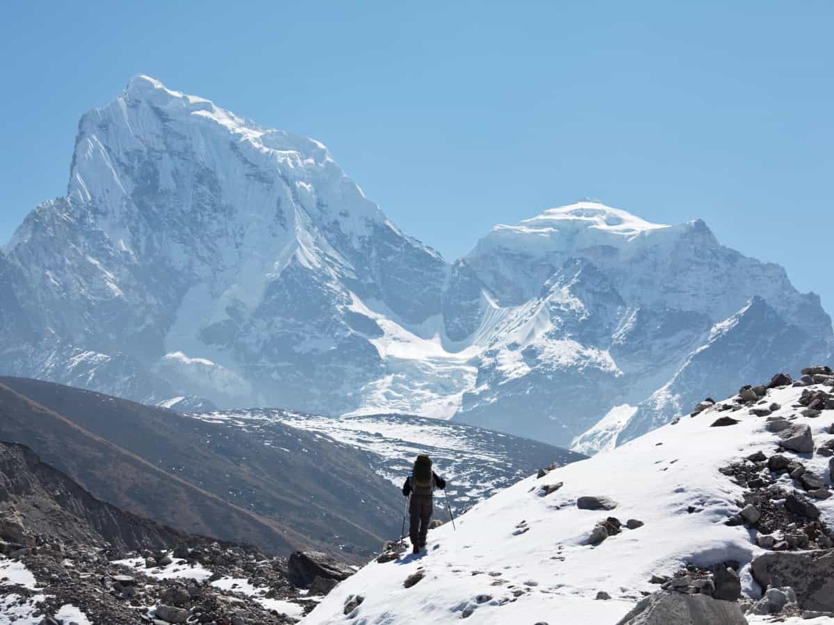 a man hiking in the himalayas