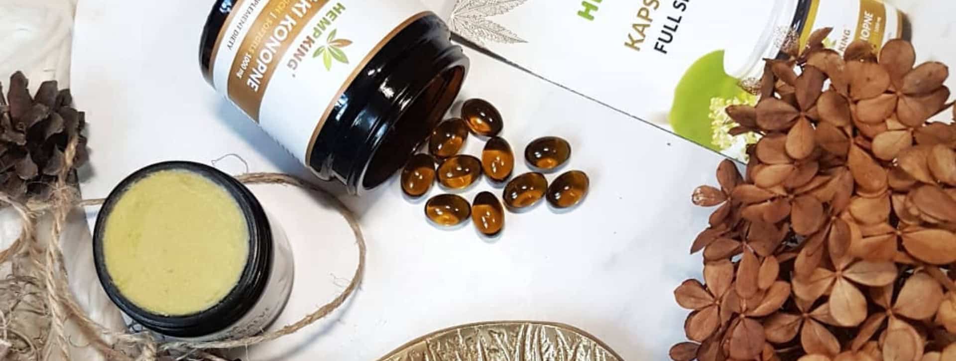 HempKing products opened on table top with plant matter banner