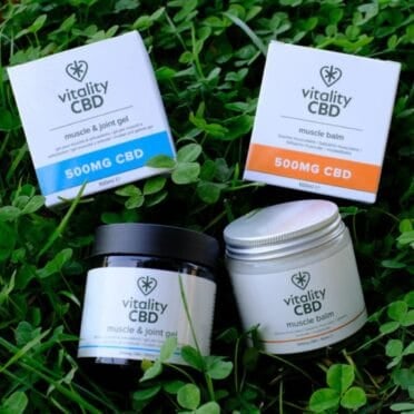 Vitality CBD Muscle Balm and Muscle & Joint gel on grass
