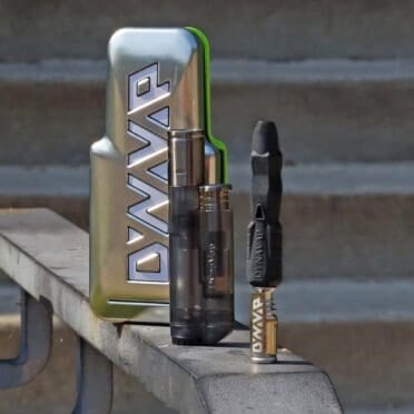 Dynavap B2 Device Packaging and Lighter on park bench