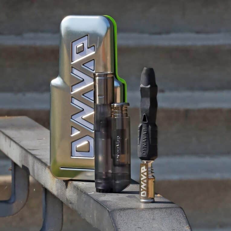 Dynavap B2 Device Packaging and Lighter on park bench