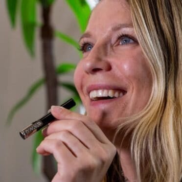 Dynavap G3 woman vaping device and smiling