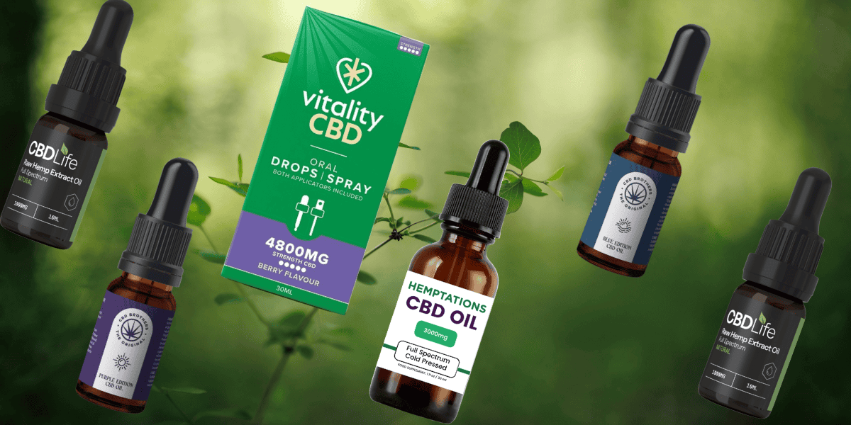 cbd oil scattered beside each other with a green nature background